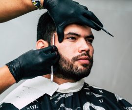 Guy shaving facial hair